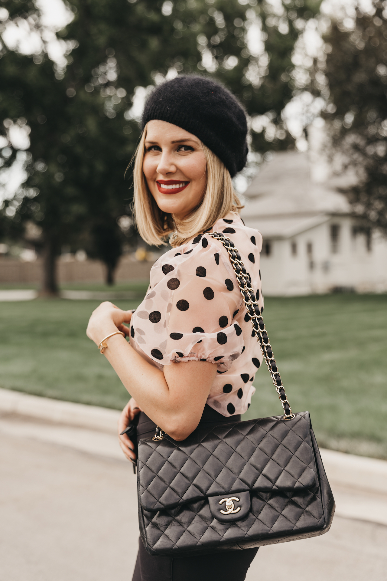 pink top with black polka dots